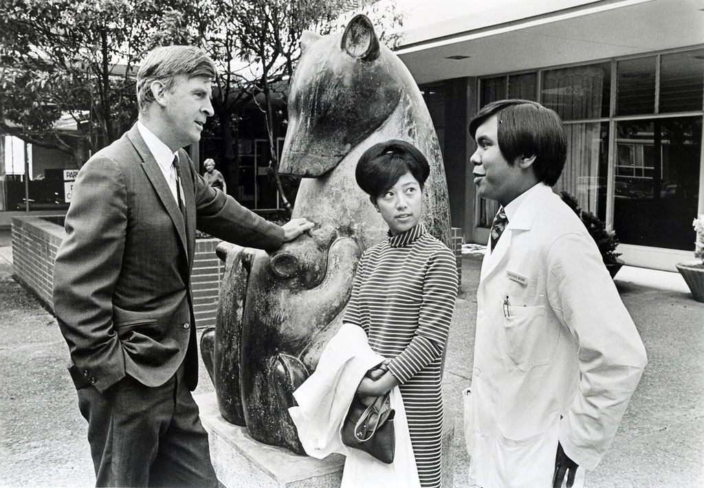 historical photo of Chancellor Philip Lee talking to students