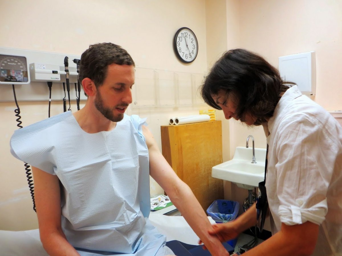 San Francisco District 8 Supervisor Scott Wiener receives a skin cancer screening from Toby Maurer, MD.