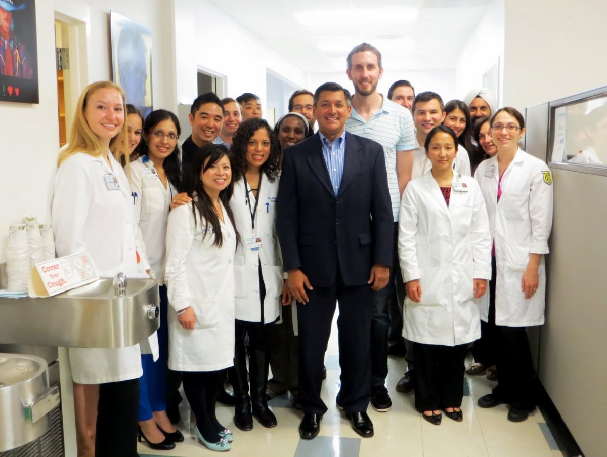 UCSF Department of Dermatology doctors pose for a photo with San Francisco Treasurer Jose Cisneros, center front, and District 8 Supervisor Scott Wiener, center back