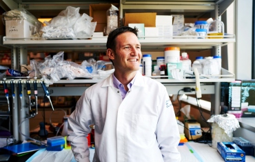 Sergio Baranzini smiling in his lab.