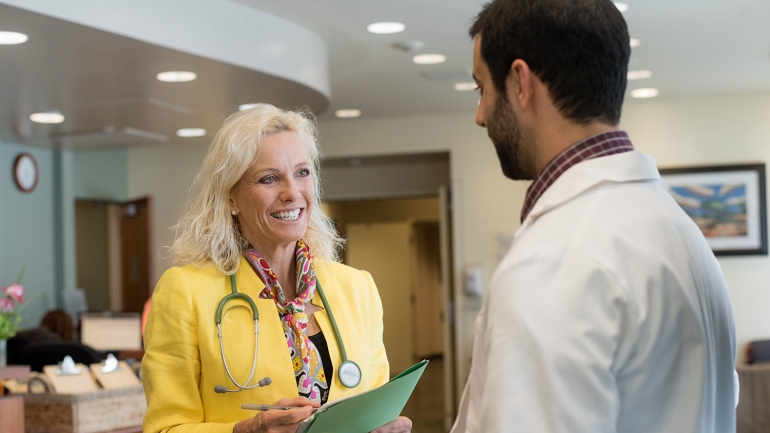 Pamela Munster, co-leader of the new UCSF Center for BRCA Research, speaks with Protocol Project Manager Kamran Abril Lavasani at the Helen Diller Family Comprehensive Cancer Center.