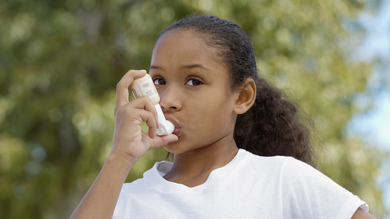 Young girl with an inhaler