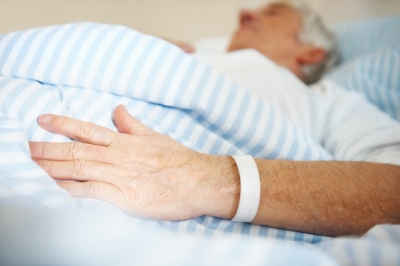 elderly man in a hospital bed