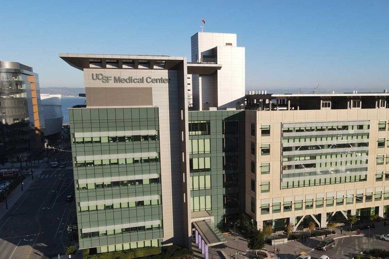 Aerial shot of the UCSF Medical Center at Mission Bay. The sky is blue in the background.
