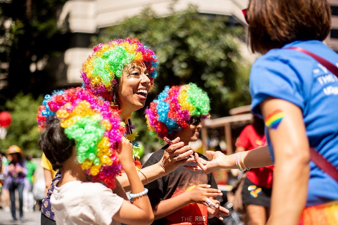 Monica Ghandi, MD, medical director of Ward 86 at ZSFG, wears a rainbow wig to the San Francisco LGBT Pride Parade