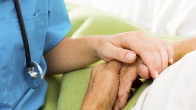 nurse-patient-holding-hands.jpg