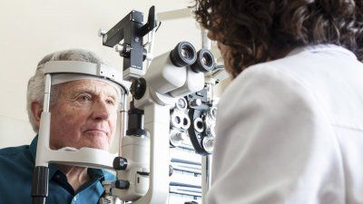 senior elderly man eye exam opthalmologist.jpg.jpg