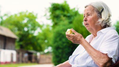 senior-woman-eating-apple.jpg