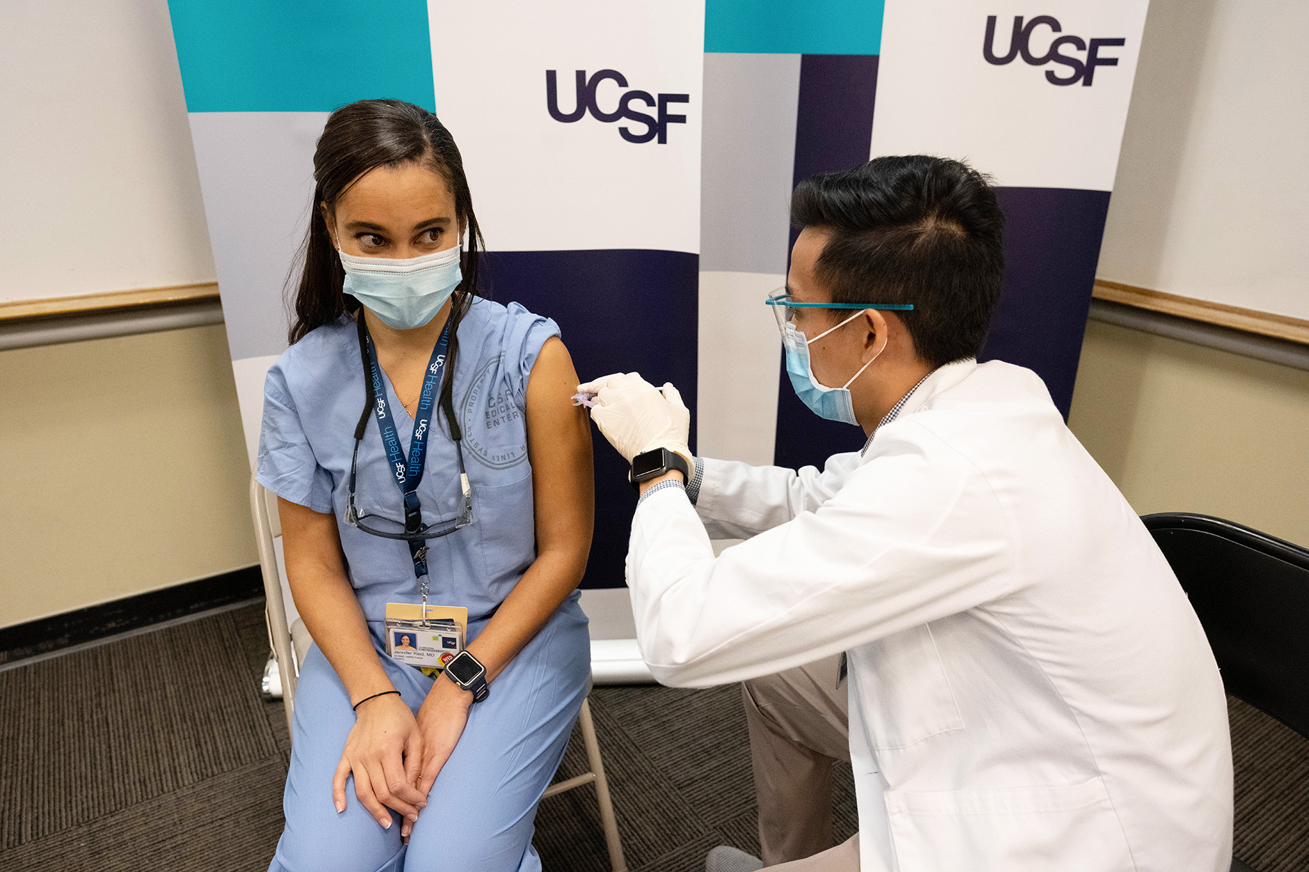 woman receives a COVID-19 vaccination shot