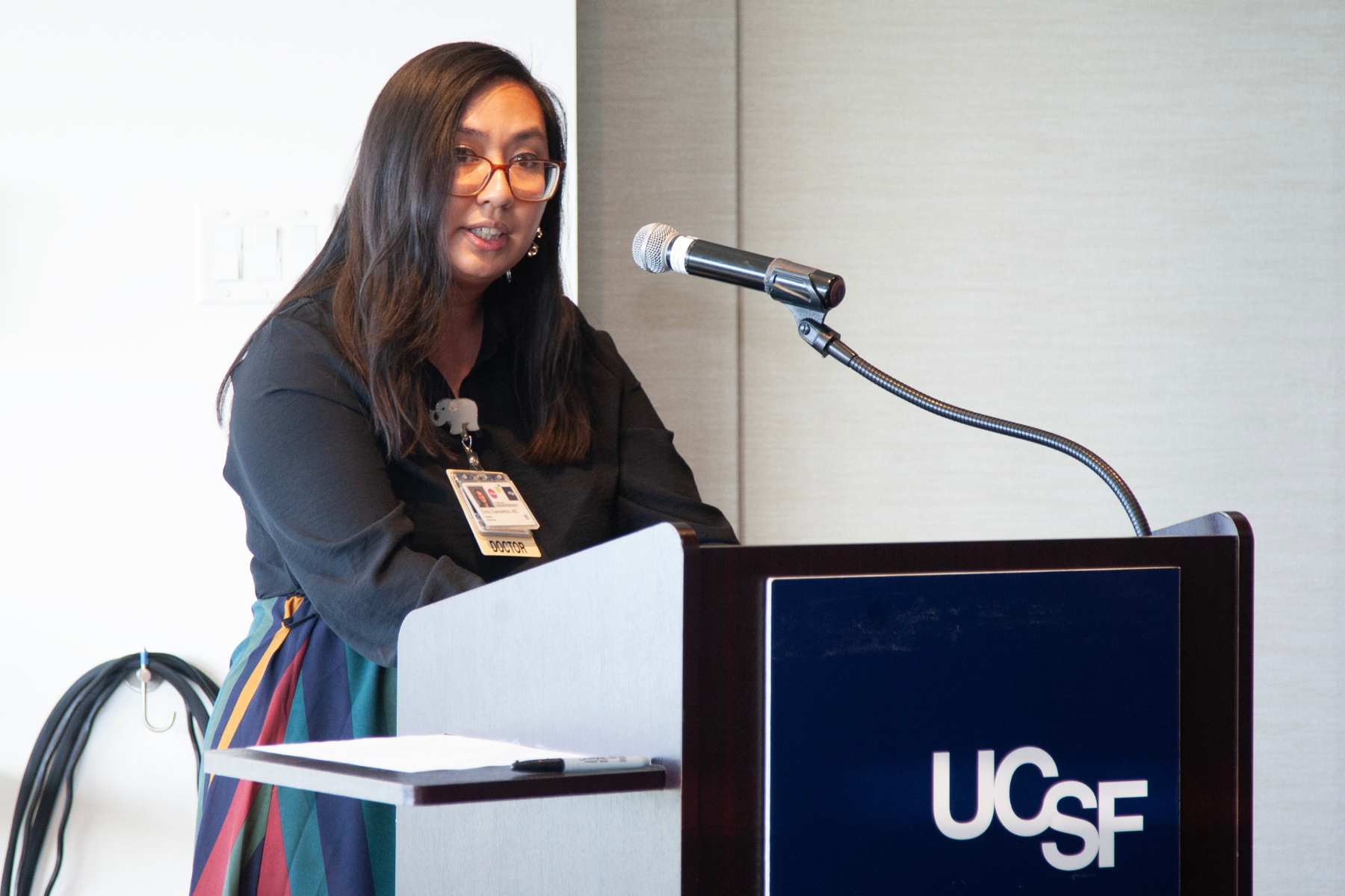 woman speak at UCSF podium