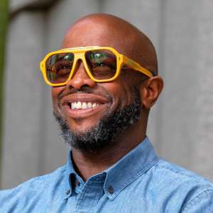 Shawn Demmons wears yellow sunglasses