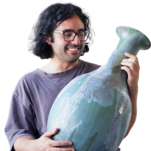 Asa Kalish holds a large shiny pot