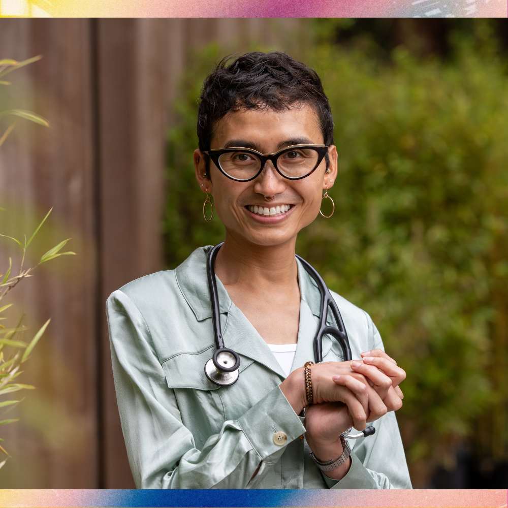 Sen wears a stethoscope and clasps her first joyfully.