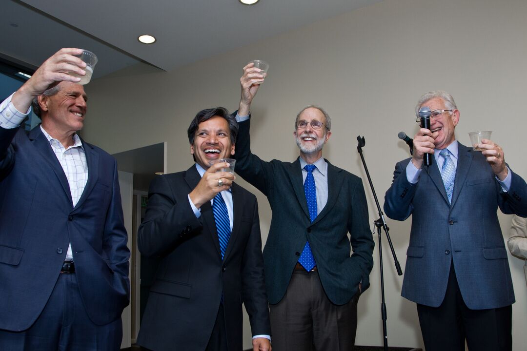 Attendees of the celebration toast Shinya Yamanaka.