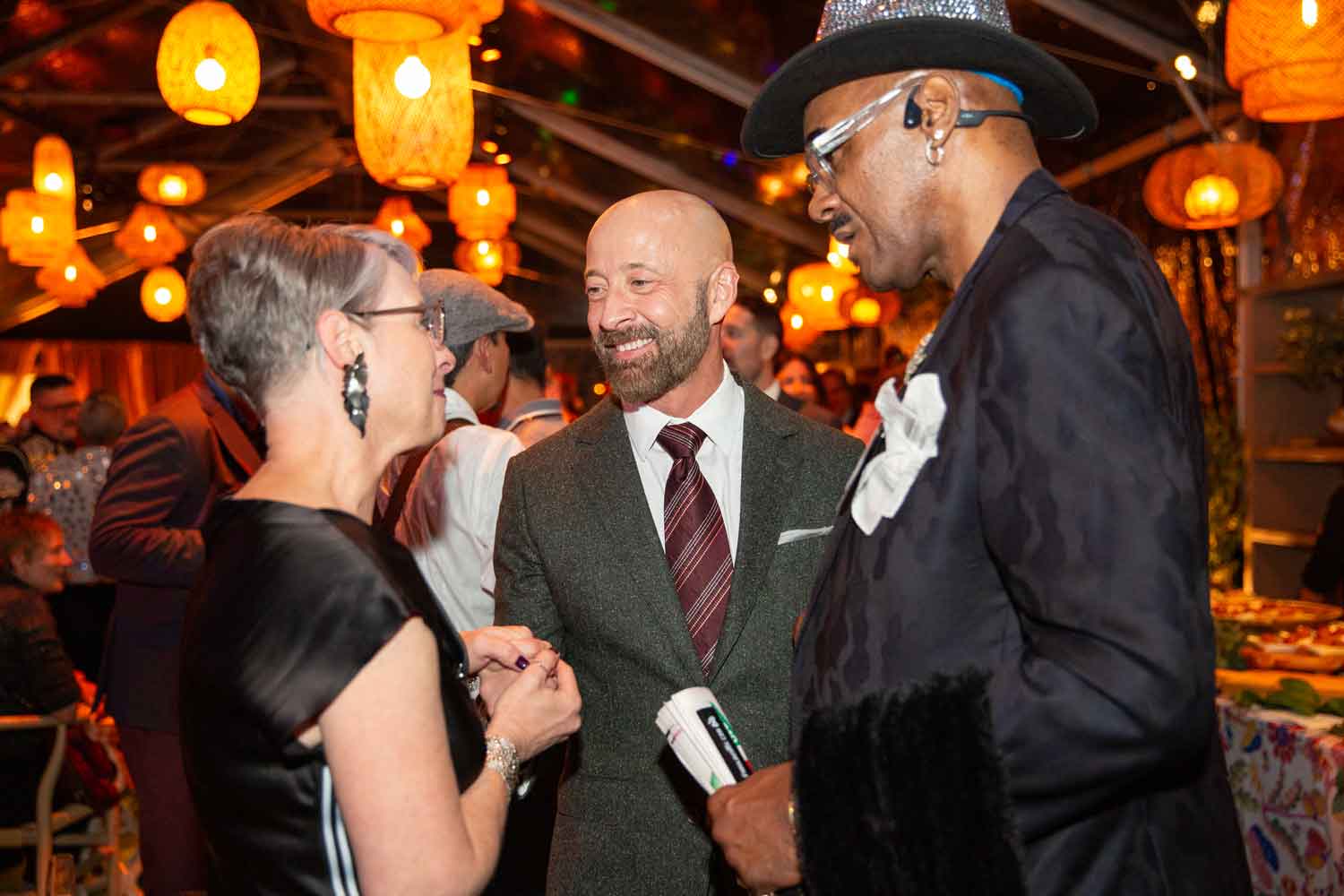 Dan Bernal smiles as he speaks with attendess of the Light in the Grove event.