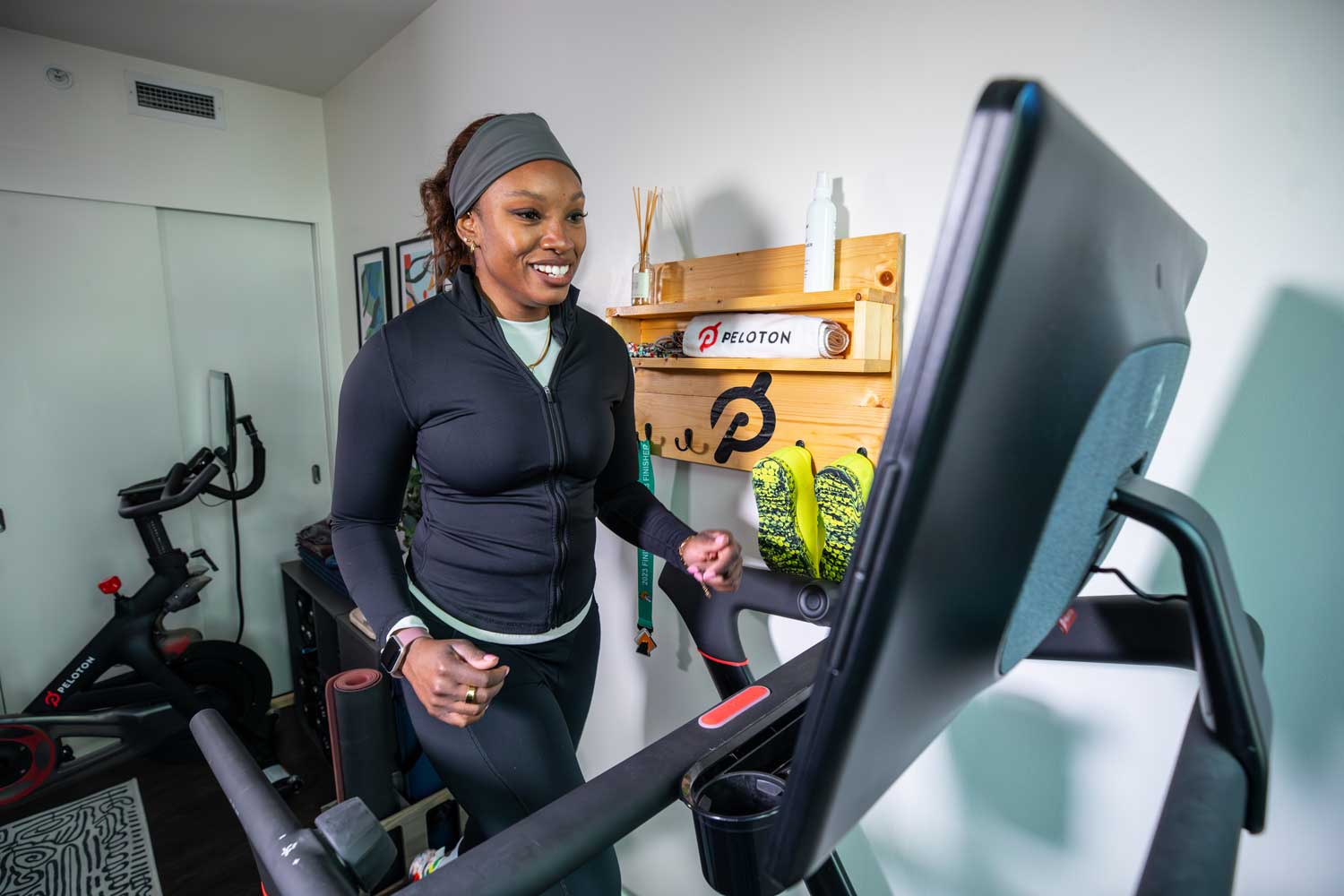 Neurologist Lauren Patrick does cardio exercise on a machine at her home.