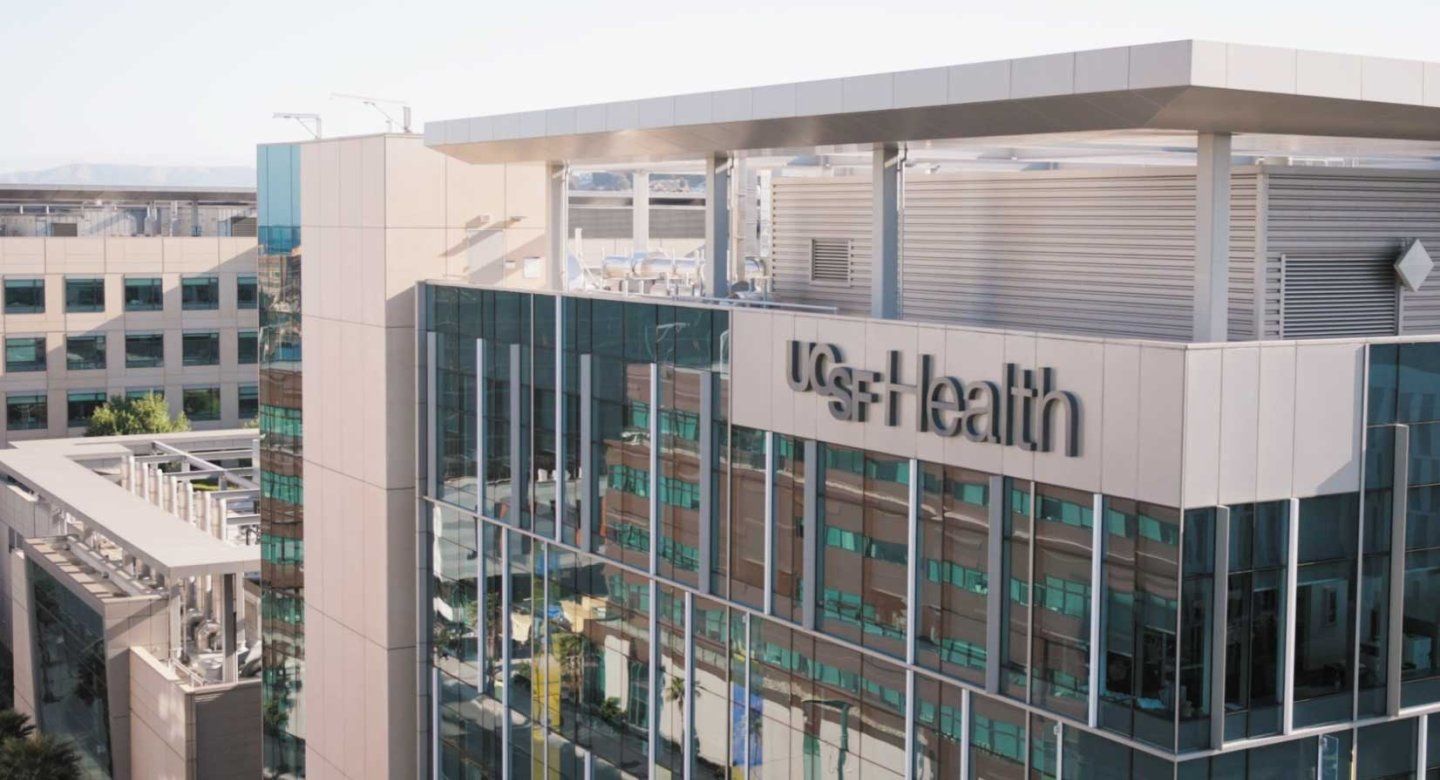 An exterior shot of the UCSF Medical Center, with signage that reads "UCSF Health."