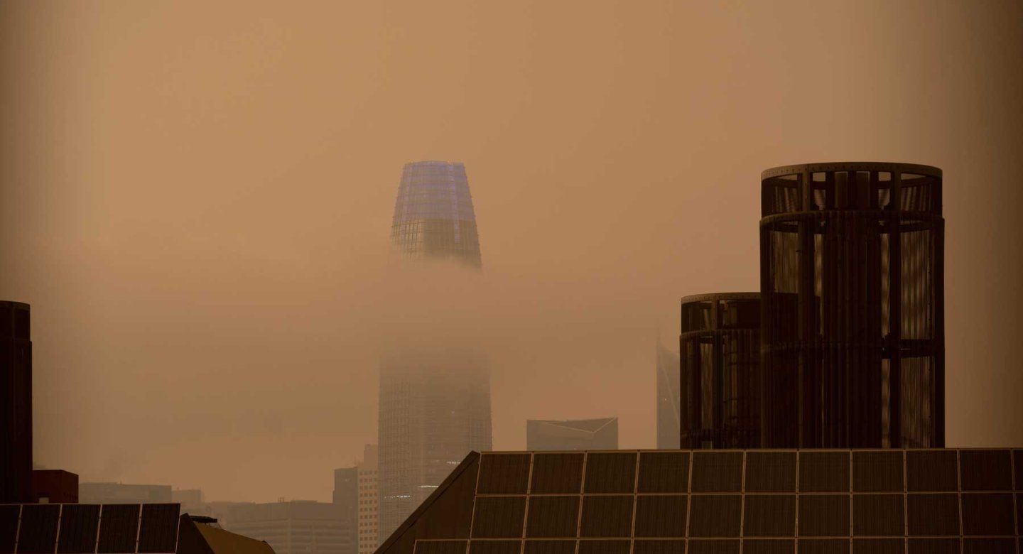 Thick, orange clouds of smoke from wildfires blanket downtown San Francisco in 2020.