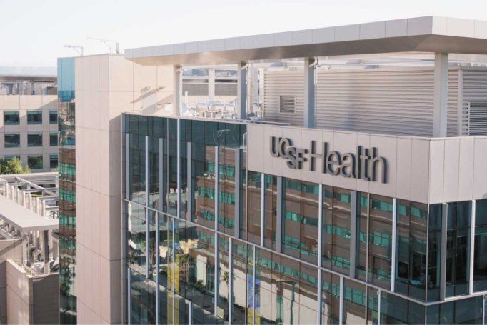 An exterior shot of the UCSF Medical Center, with signage that reads "UCSF Health."