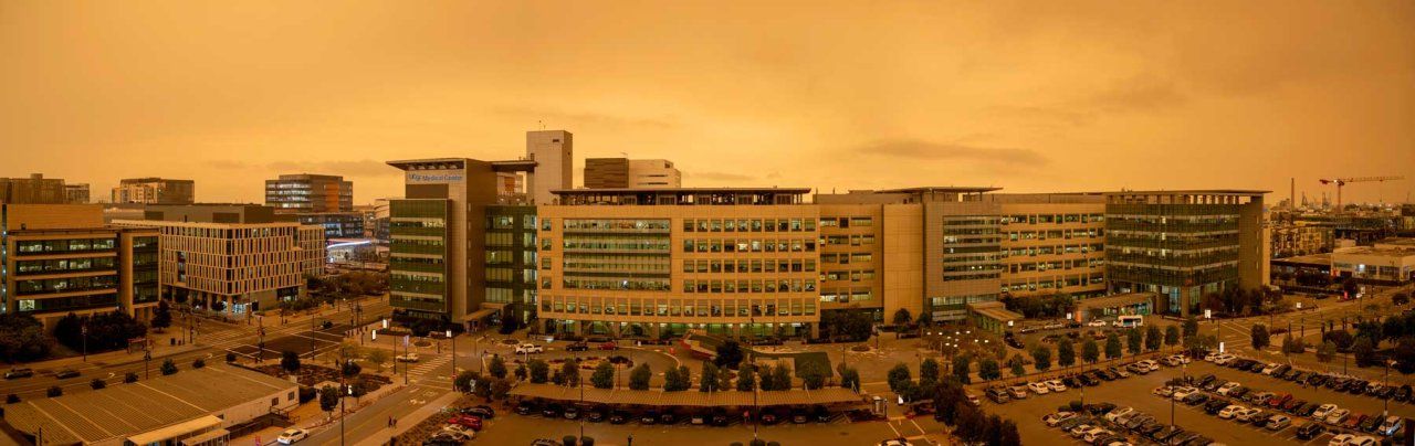 Thick, orange clouds of smoke from wildfires blanket the UCSF Medical Center in Mission Bay in 2020.