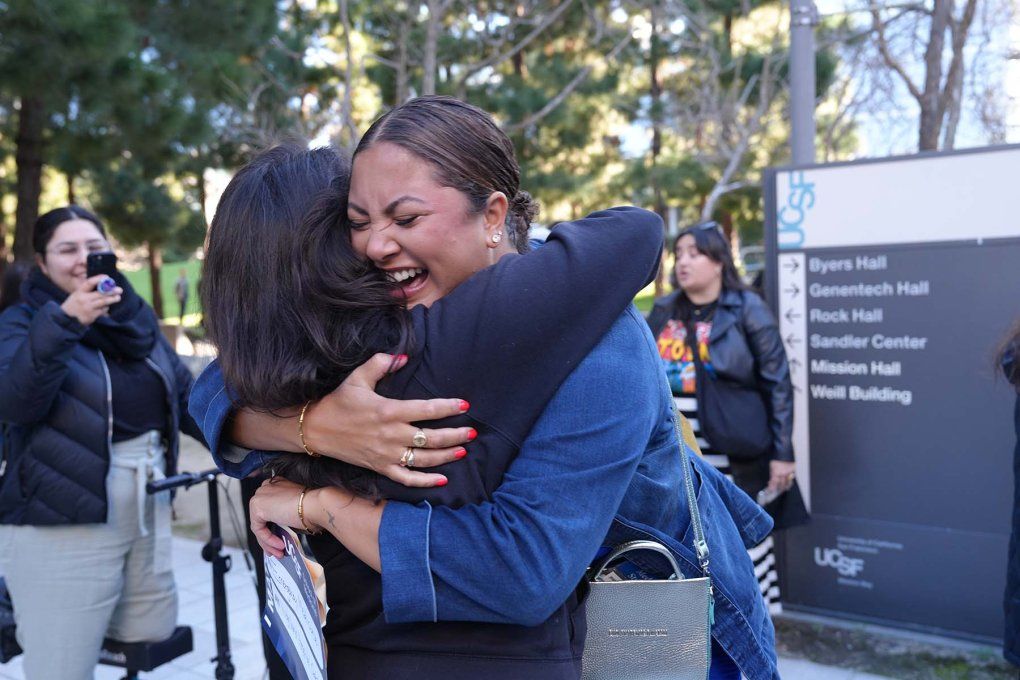 Two women hug and cry with joy as they find out where they've been selected for med school.