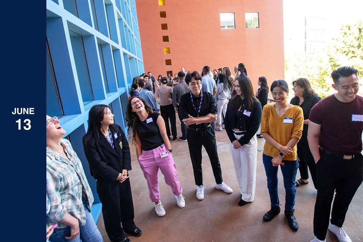 A group of students laugh at the School of Nursing Orientation