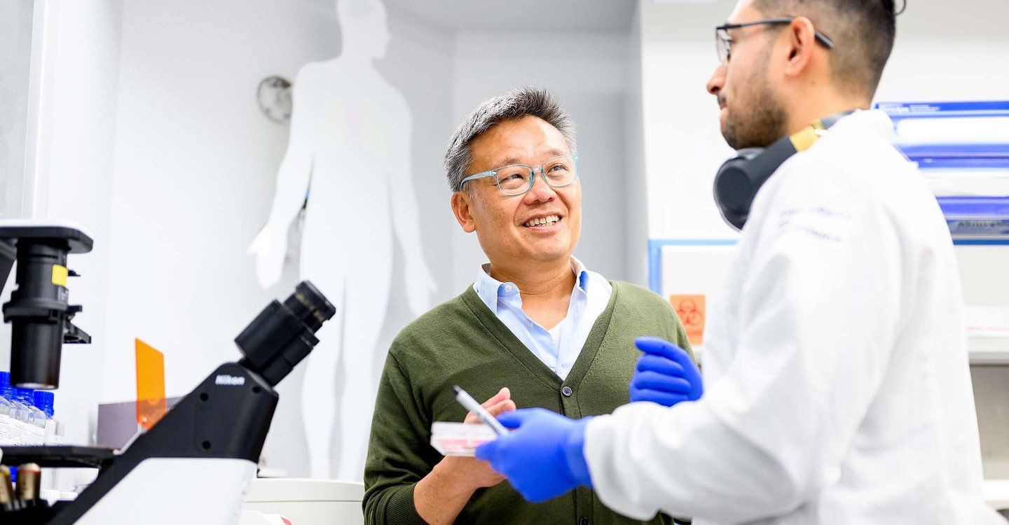 Professor Wendell Lim speaks with fellow researcher and postdoc Oscar Campos in his lab.