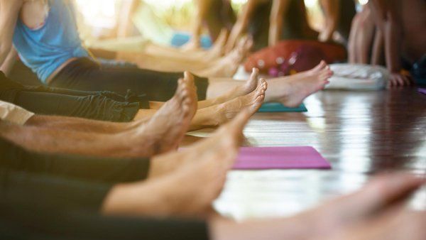 A group of women practising yoga.