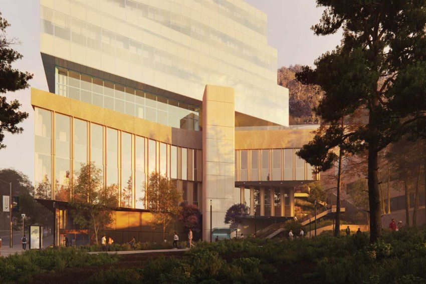 A rendered conceptual image of the outside facade of the UCSF Bakar Research and Academic Building at sunset, which has modern glass and concrete features.